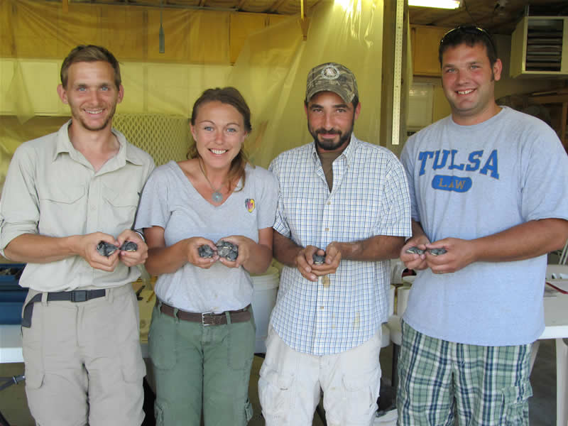Devin, their Intern, holding 2, Dana holding 3, Ethan holding 1, and Jeremy, my son, holding 2.
