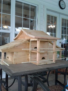 Painted white with green roof and added top perch now.