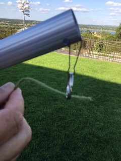 Stringing bean bag through pole.jpg